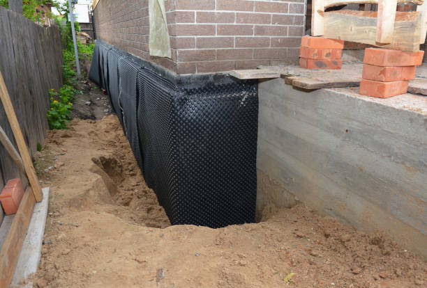 Happy homeowners after waterproofing job in Independence